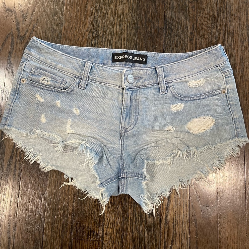 Express Women’s light blue distressed denim shorts (size 6)